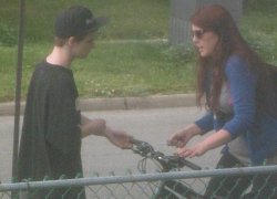June 11, 2015 - Hoodrat impatient for a fix from his dealer